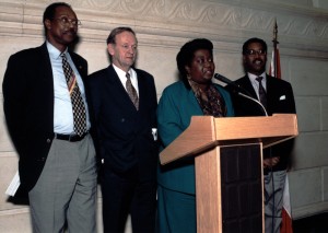 Jean Augustine speaking at first federal celebration of Black History Month, flanked by Prime Minister Jean Chretien and MP Ovid Jackson, 13 February, 1996. Image no. ASC04453.
