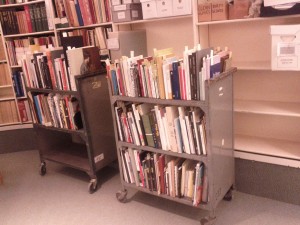 Two rolling carts full of books and pamphlets for addition to the Special Collections.