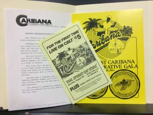 Image of an opened file folder with three documents, two yellow, on Caribana.